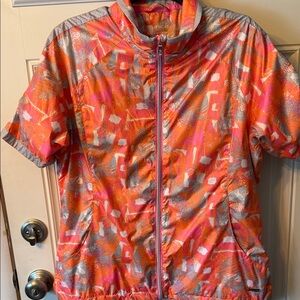 Sunice Women's Orange and Pink Jacket Rain Gear for Golf.